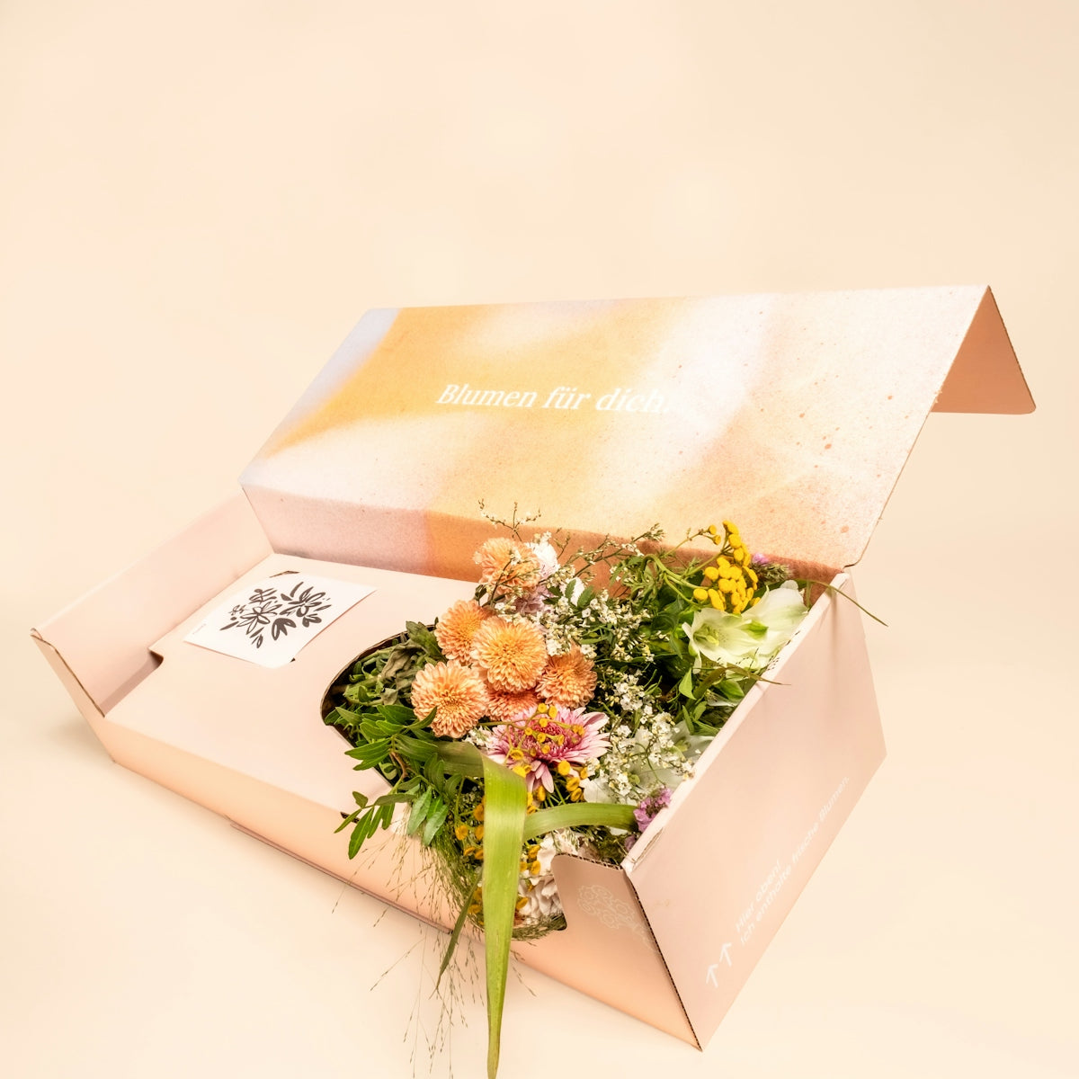 A bouquet of flowers in an open box