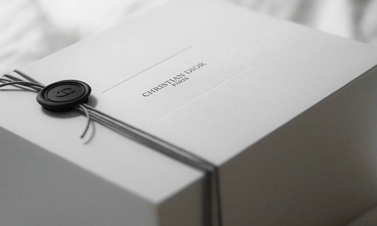 White dior gift box with black wax seal