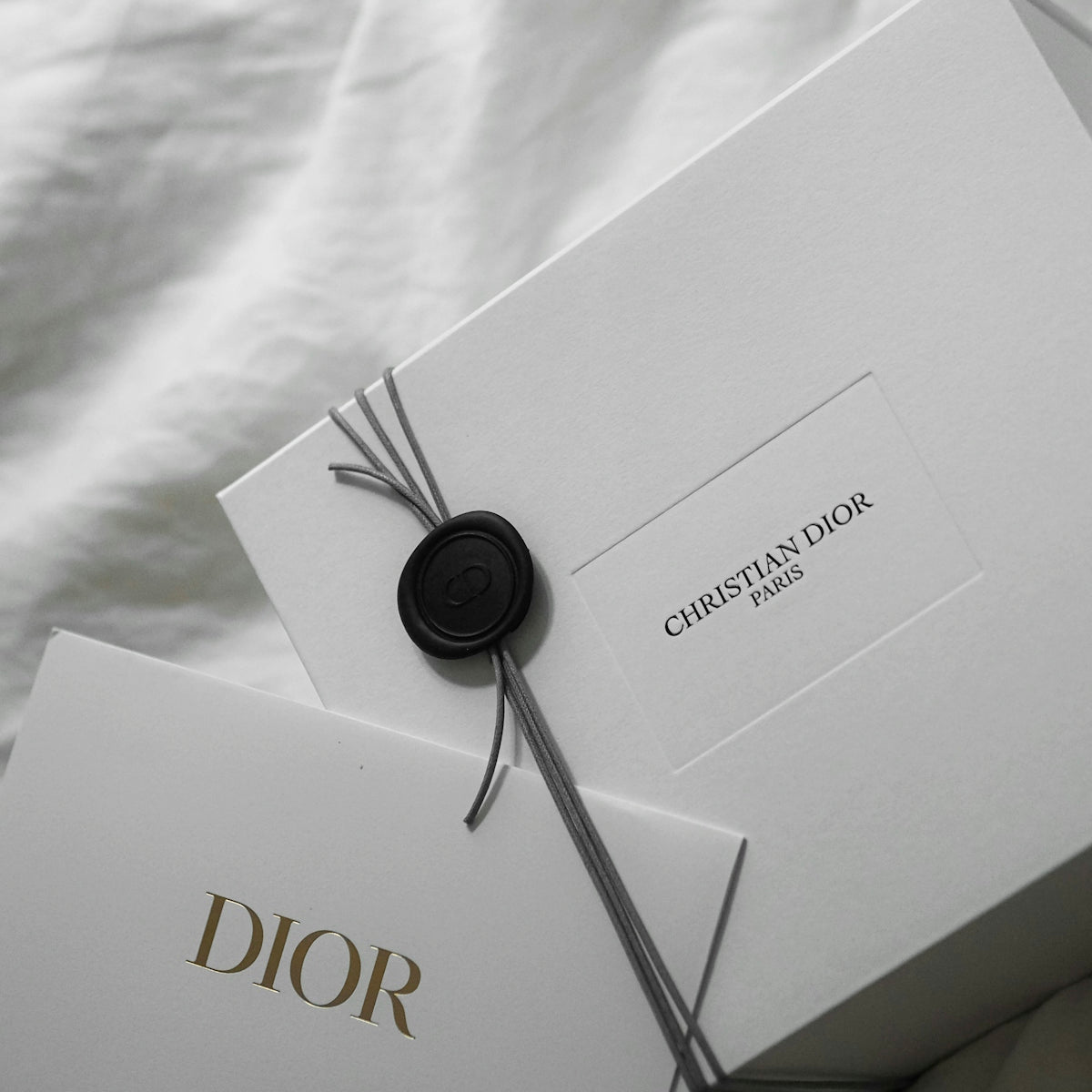 White dior box with wax seal and tag