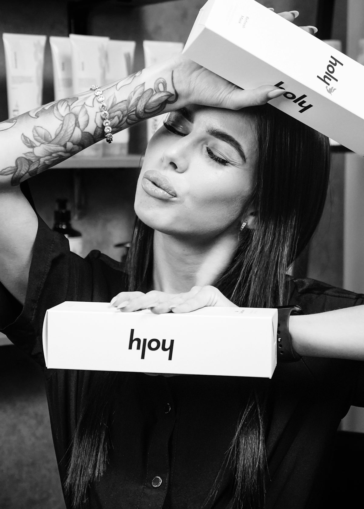 Woman holding boxes with her head and hands