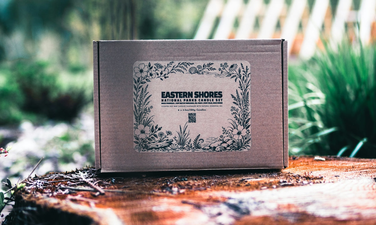 Cardboard box with floral label on tree stump.